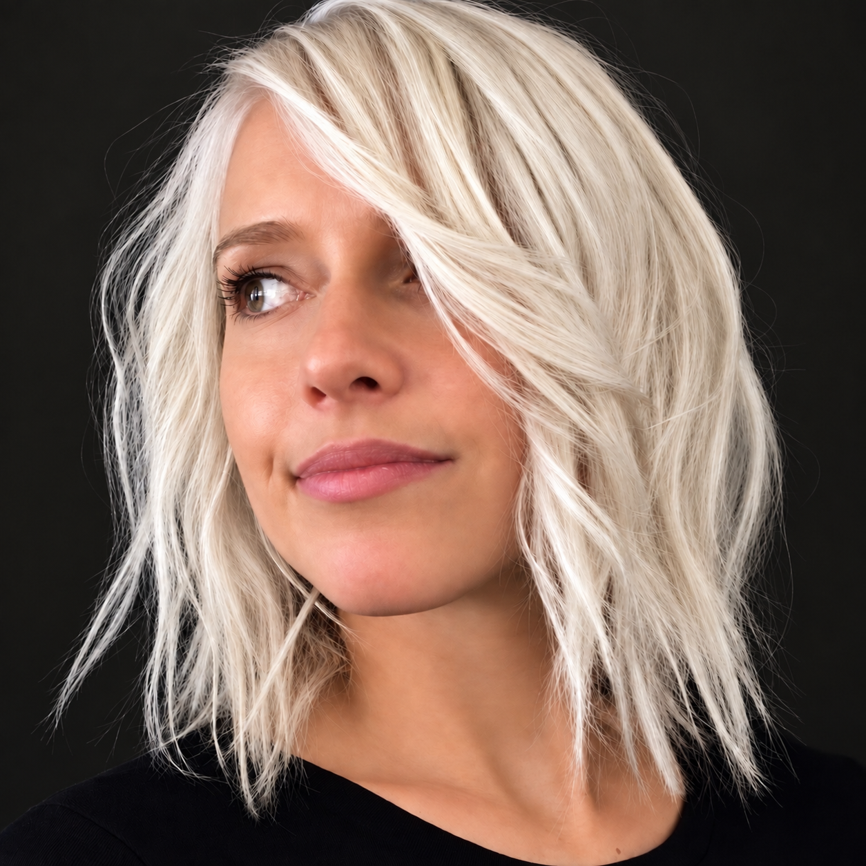 Soft platinum blonde hair color by Bradley Sanders