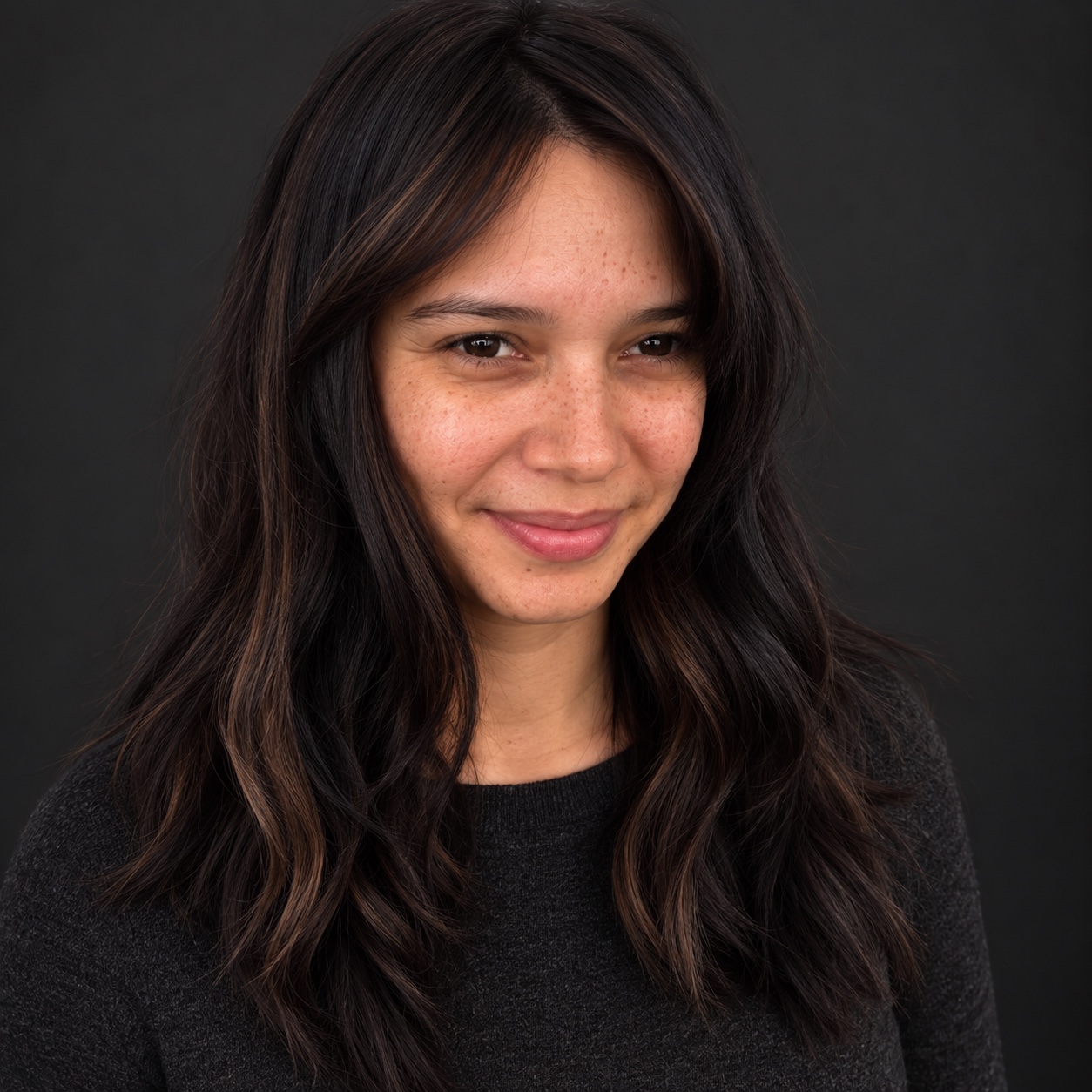 Long dimensional brunette hair color by Bradley Sanders
